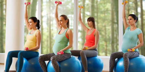 pregnant women on exercise ball